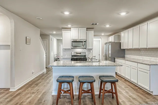 a view of living room with granite countertop furniture and fireplace