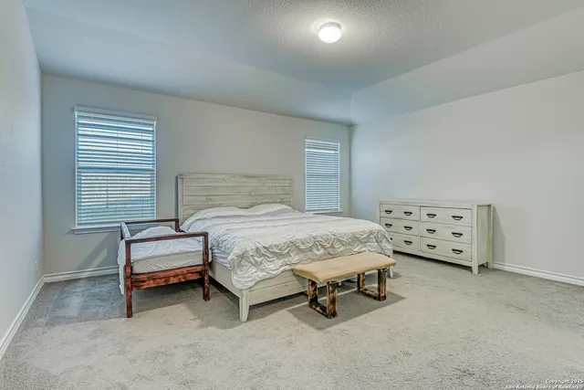 a bedroom with a bed and a cabinets