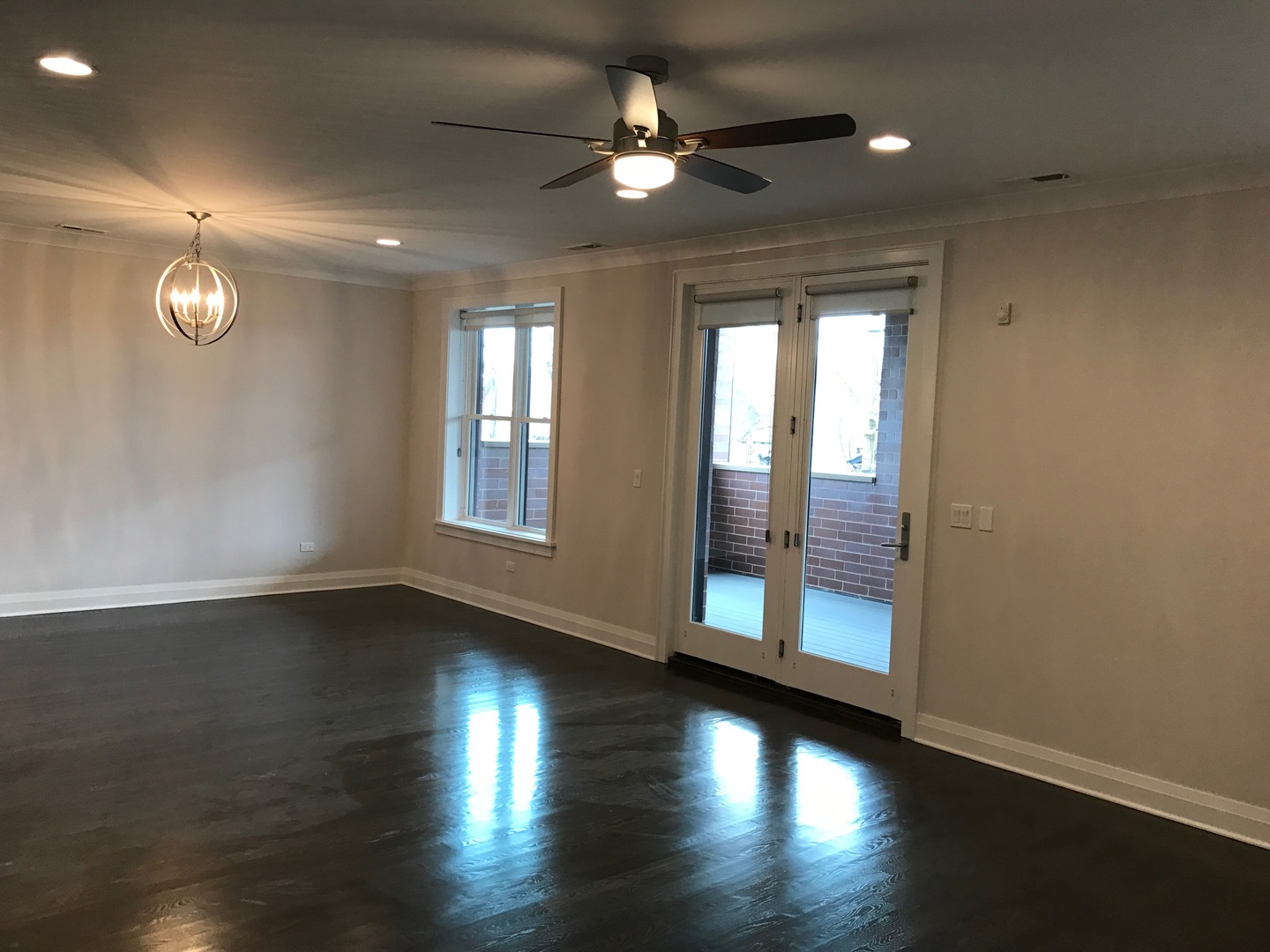 1843 West Irving Park Road, Unit 3 Chicago, IL 60613 - Photo 22 of 34 a view of an empty room with wooden floor and a window
