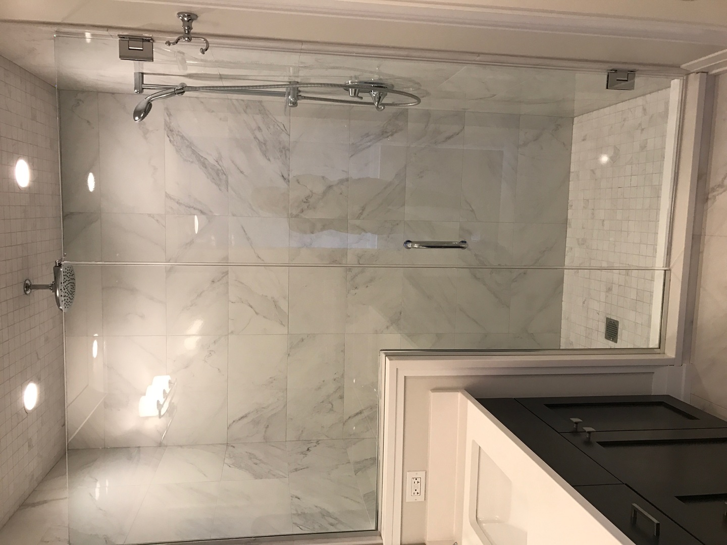 1843 West Irving Park Road, Unit 3 Chicago, IL 60613 - Photo 26 of 34 a bathroom with a granite countertop shower a vanity and a sink