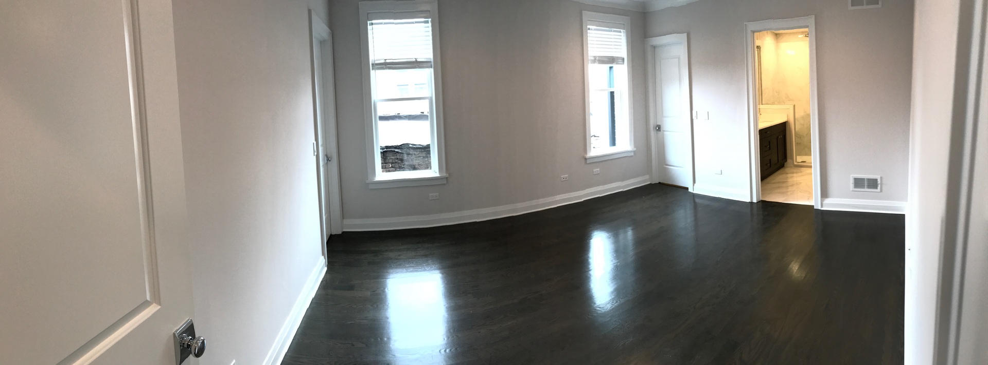1843 West Irving Park Road, Unit 3 Chicago, IL 60613 - Photo 34 of 34 a view of an empty room with wooden floor and a window