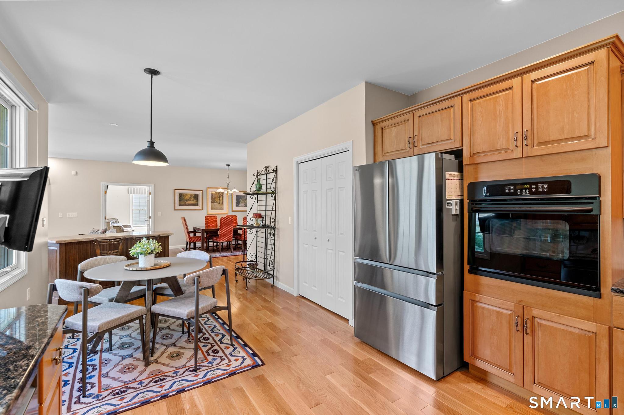 31 Gooseberry Road Suffield, CT 06078 - Photo 14 of 33 a kitchen with stainless steel appliances a stove a refrigerator and wooden cabinets
