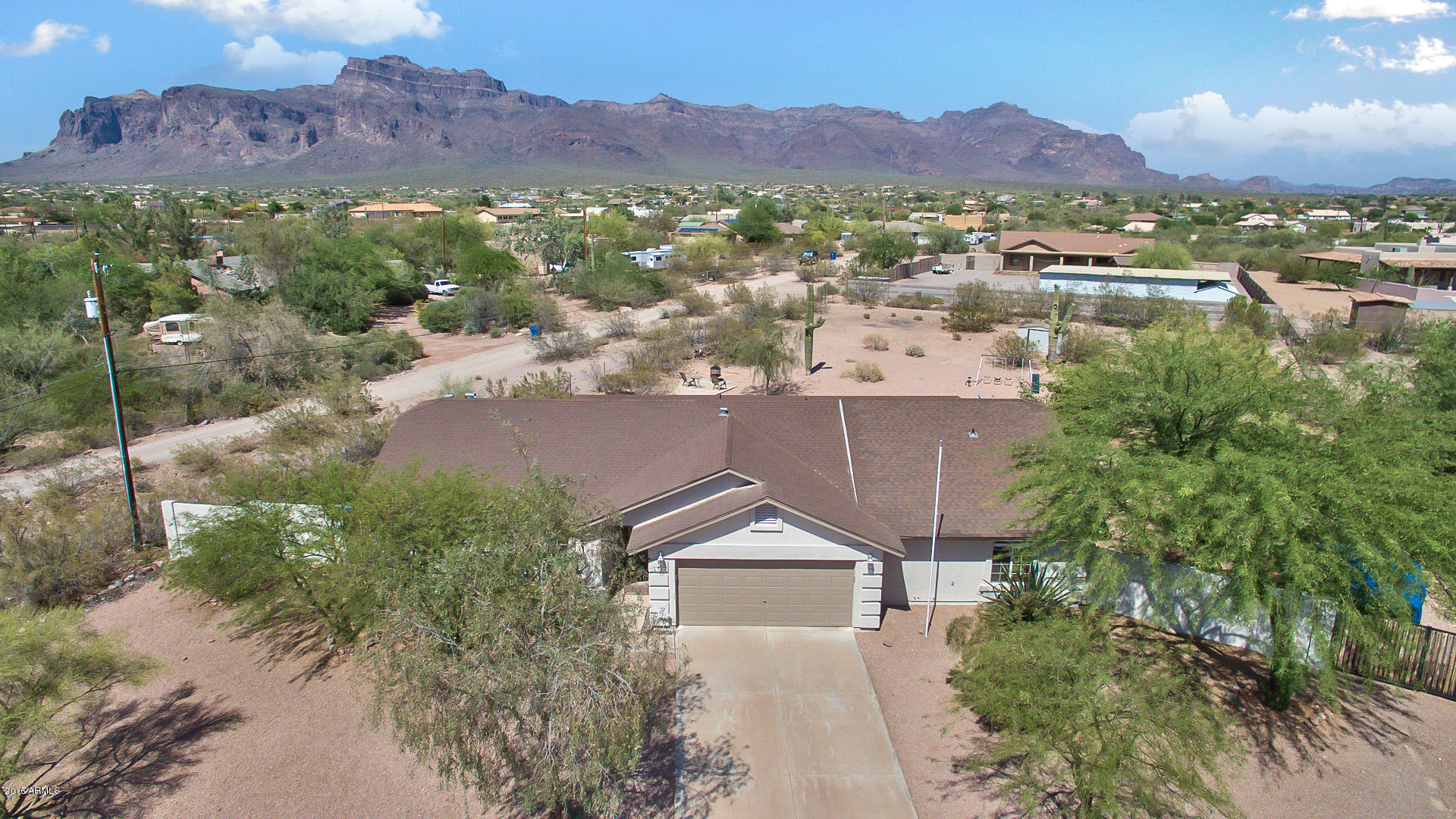 2001 South Mountain View Road Apache Junction, AZ 85119 - Photo 1 of 46 an aerial view of residential houses with outdoor space and trees
