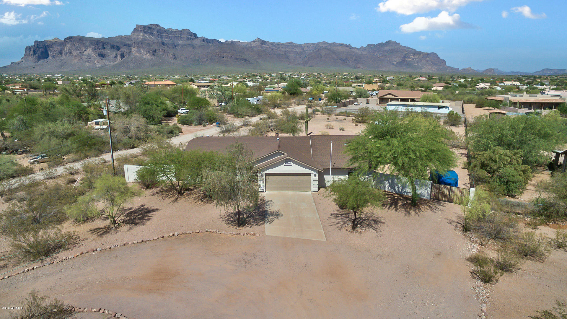 2001 South Mountain View Road Apache Junction, AZ 85119 - Photo 11 of 46 an aerial view of a house with a yard and lake view