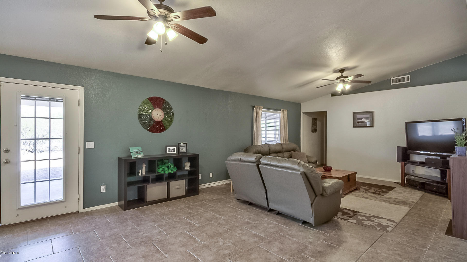 2001 South Mountain View Road Apache Junction, AZ 85119 - Photo 14 of 46 a living room with furniture and a flat screen tv