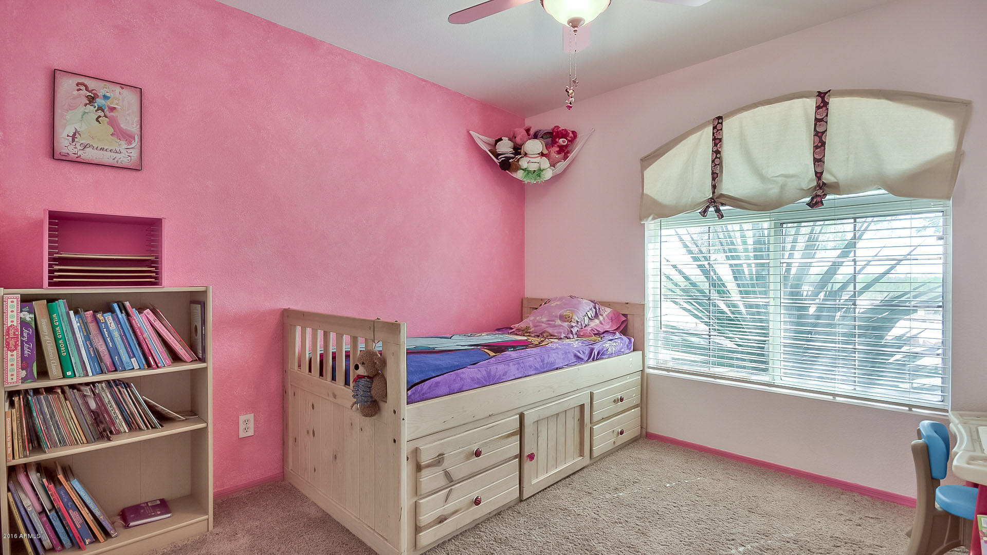 2001 South Mountain View Road Apache Junction, AZ 85119 - Photo 16 of 46 a bedroom with furniture and a book shelf