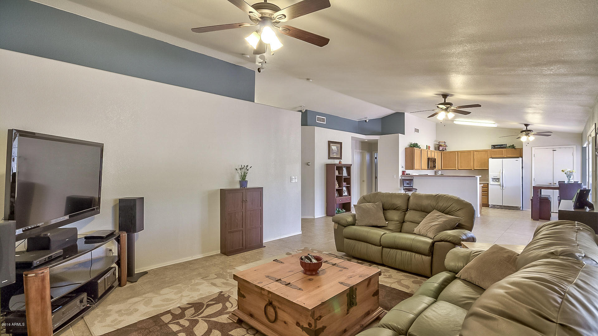 2001 South Mountain View Road Apache Junction, AZ 85119 - Photo 2 of 46 a living room with furniture and a flat screen tv