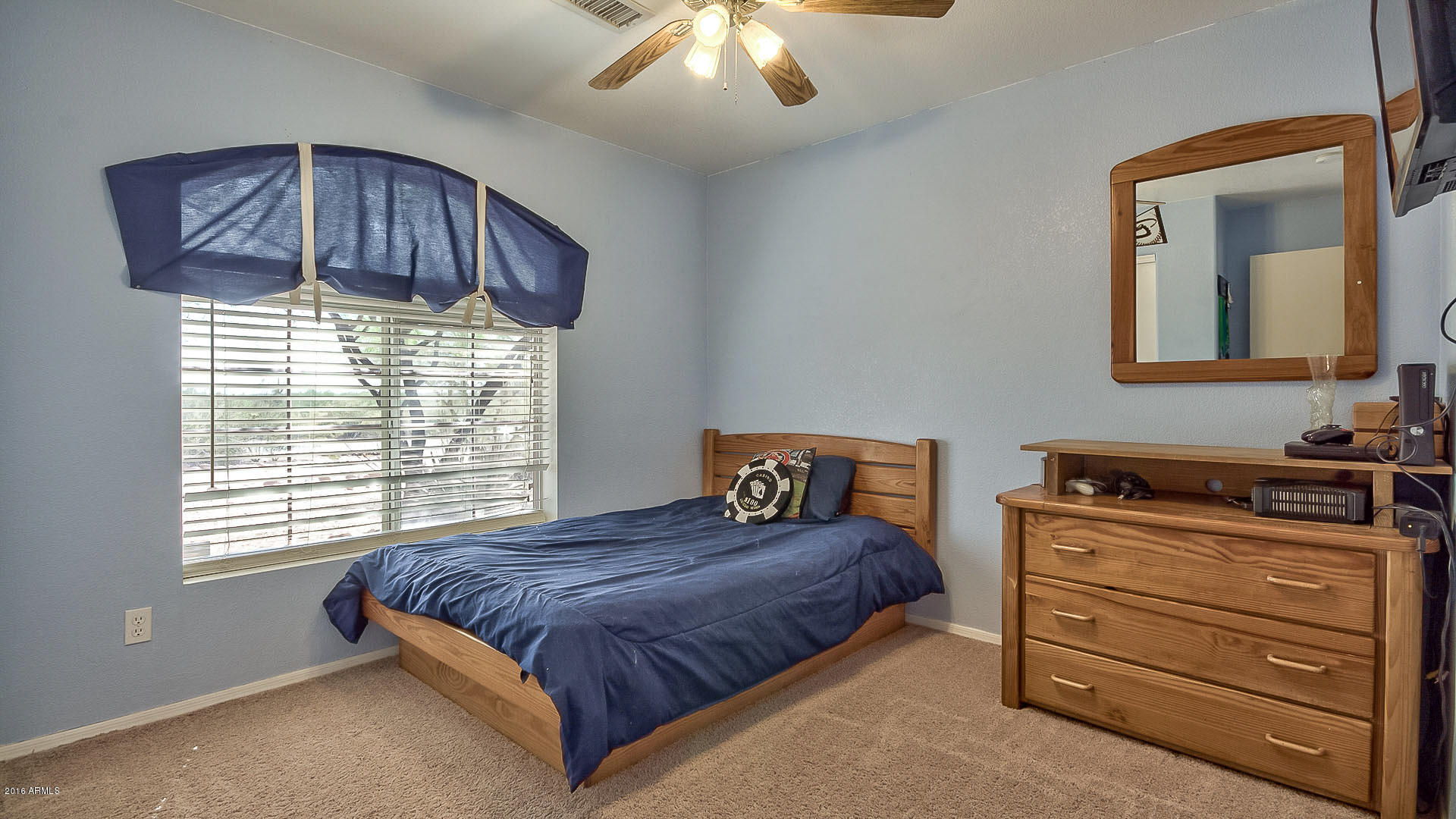 2001 South Mountain View Road Apache Junction, AZ 85119 - Photo 23 of 46 a bedroom with a bed and a dresser