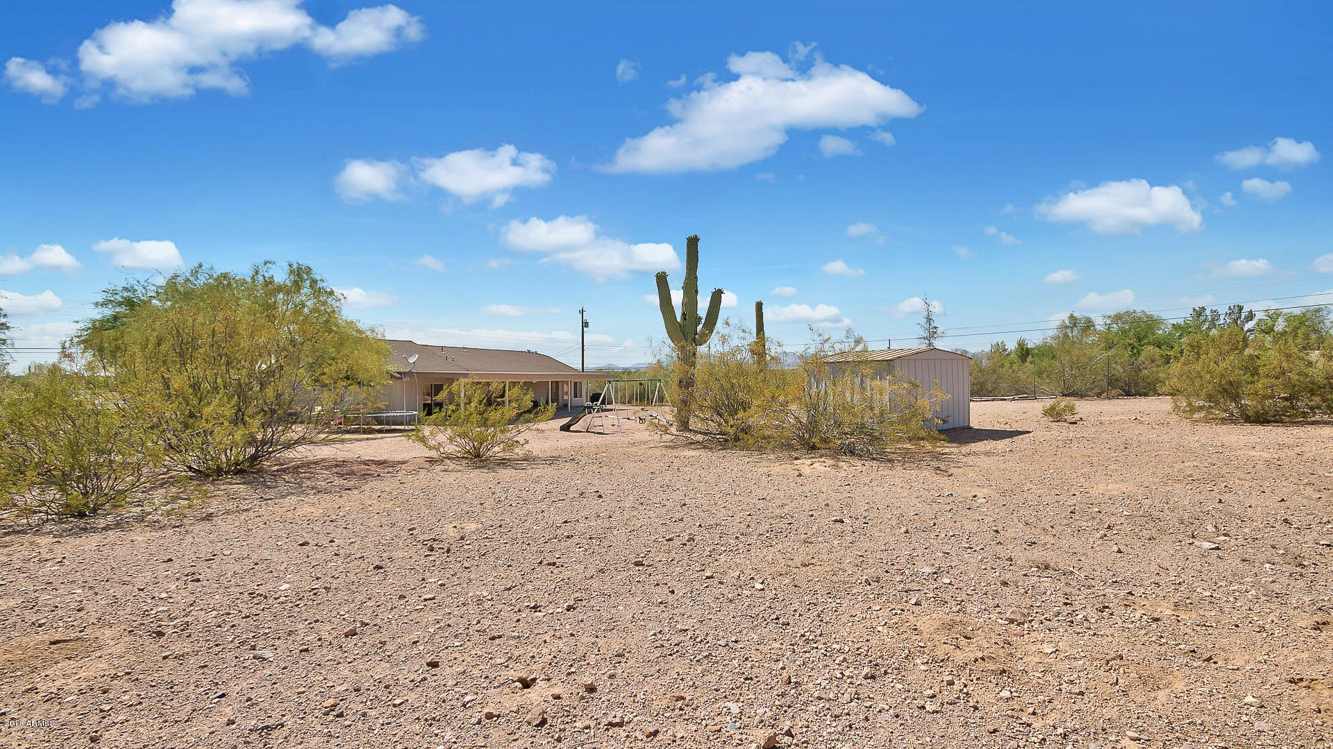 2001 South Mountain View Road Apache Junction, AZ 85119 - Photo 24 of 46 a view of a dry yard with wooden fence