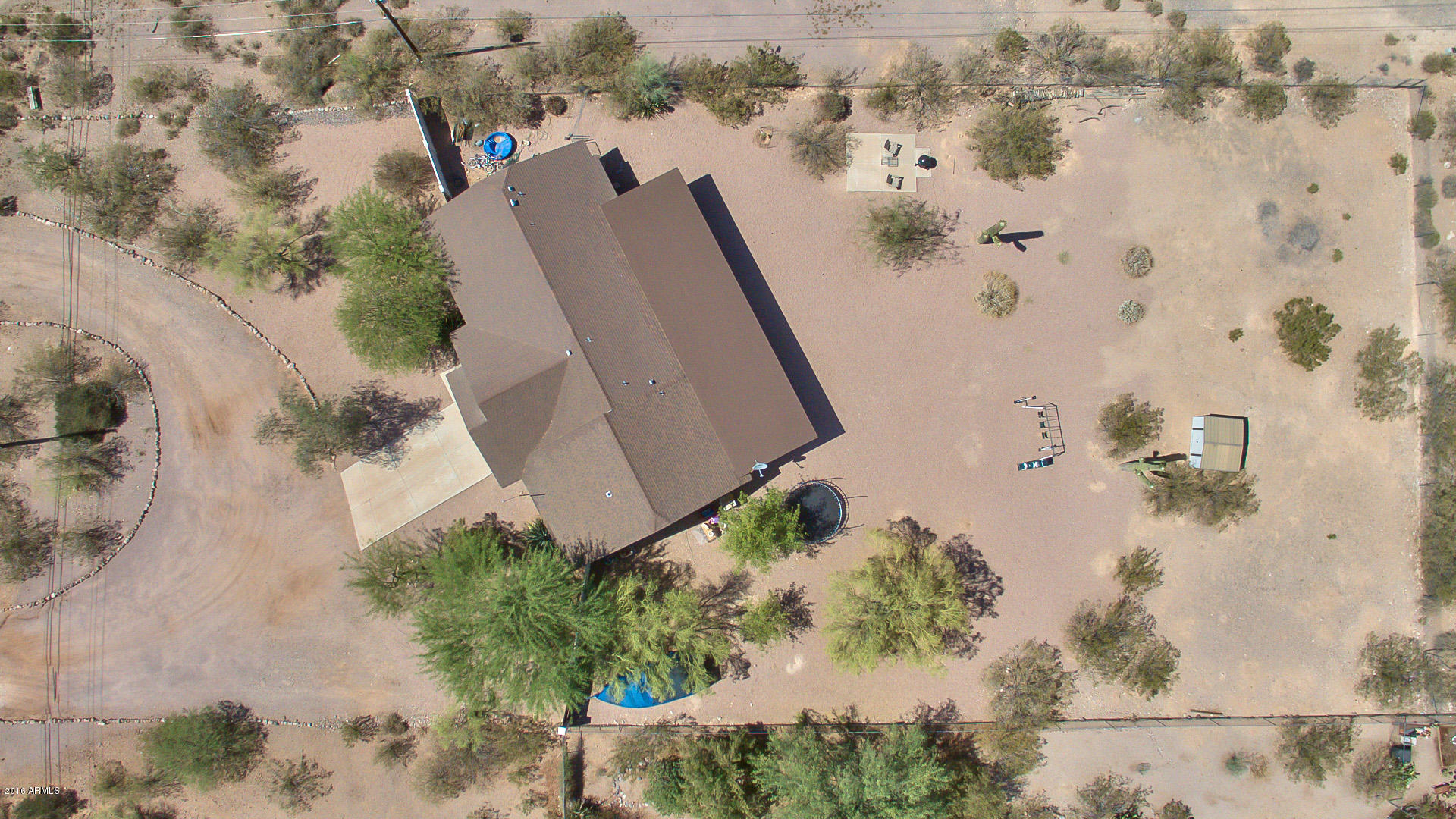 2001 South Mountain View Road Apache Junction, AZ 85119 - Photo 27 of 46 an aerial view of a house with a yard and large trees
