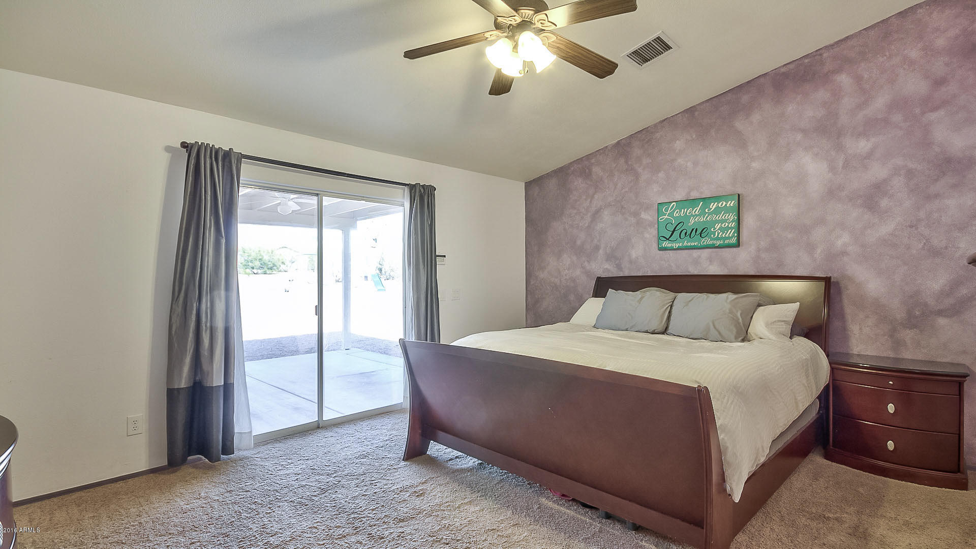 2001 South Mountain View Road Apache Junction, AZ 85119 - Photo 3 of 46 a bedroom with a large bed and a chandelier