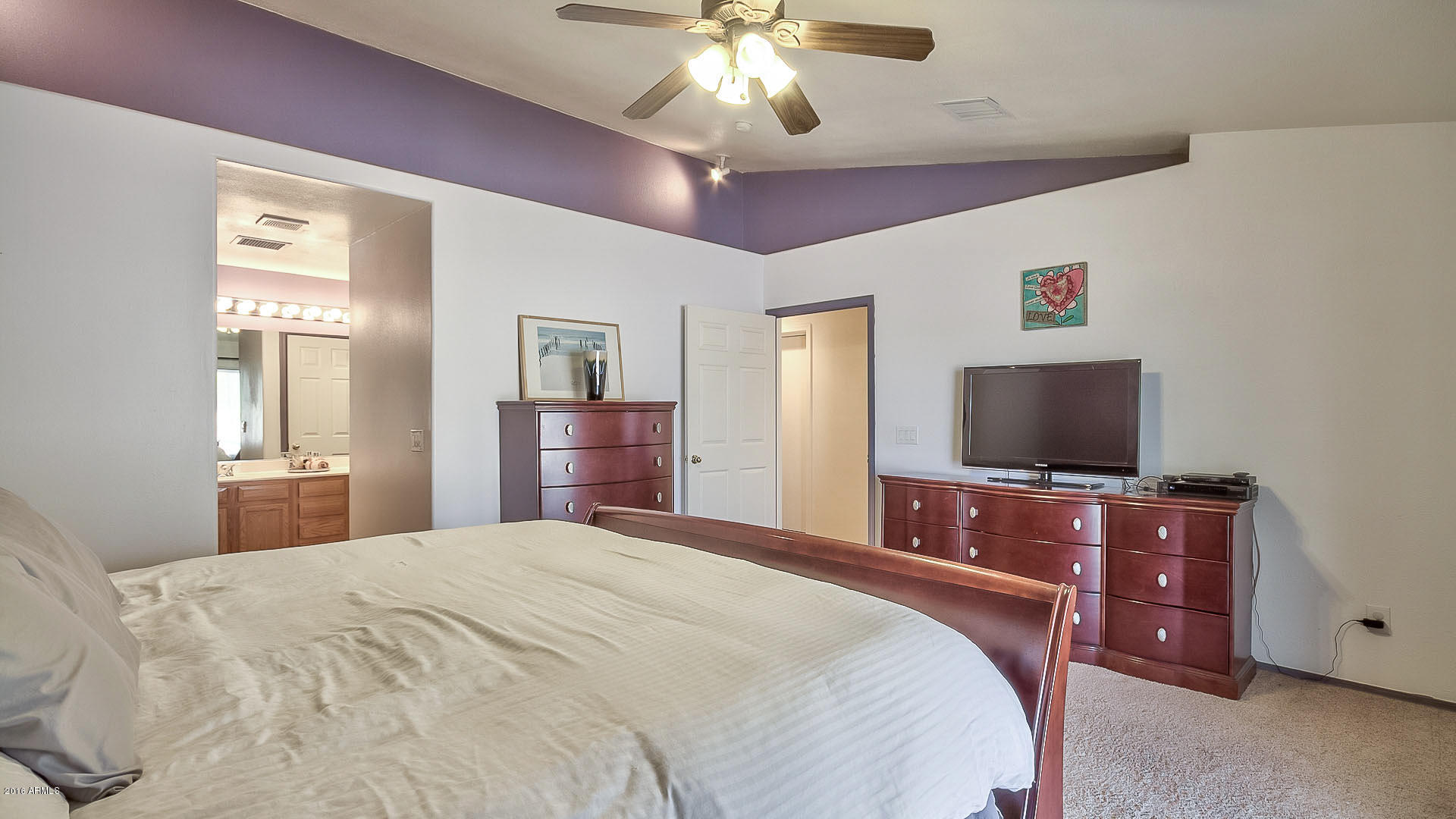 2001 South Mountain View Road Apache Junction, AZ 85119 - Photo 31 of 46 a bedroom with a bed and a flat screen tv