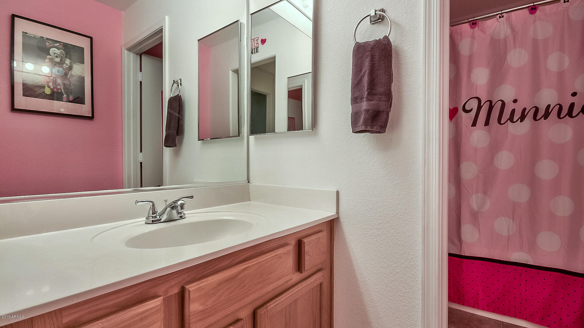 2001 South Mountain View Road Apache Junction, AZ 85119 - Photo 42 of 46 a bathroom with a sink vanity and mirror