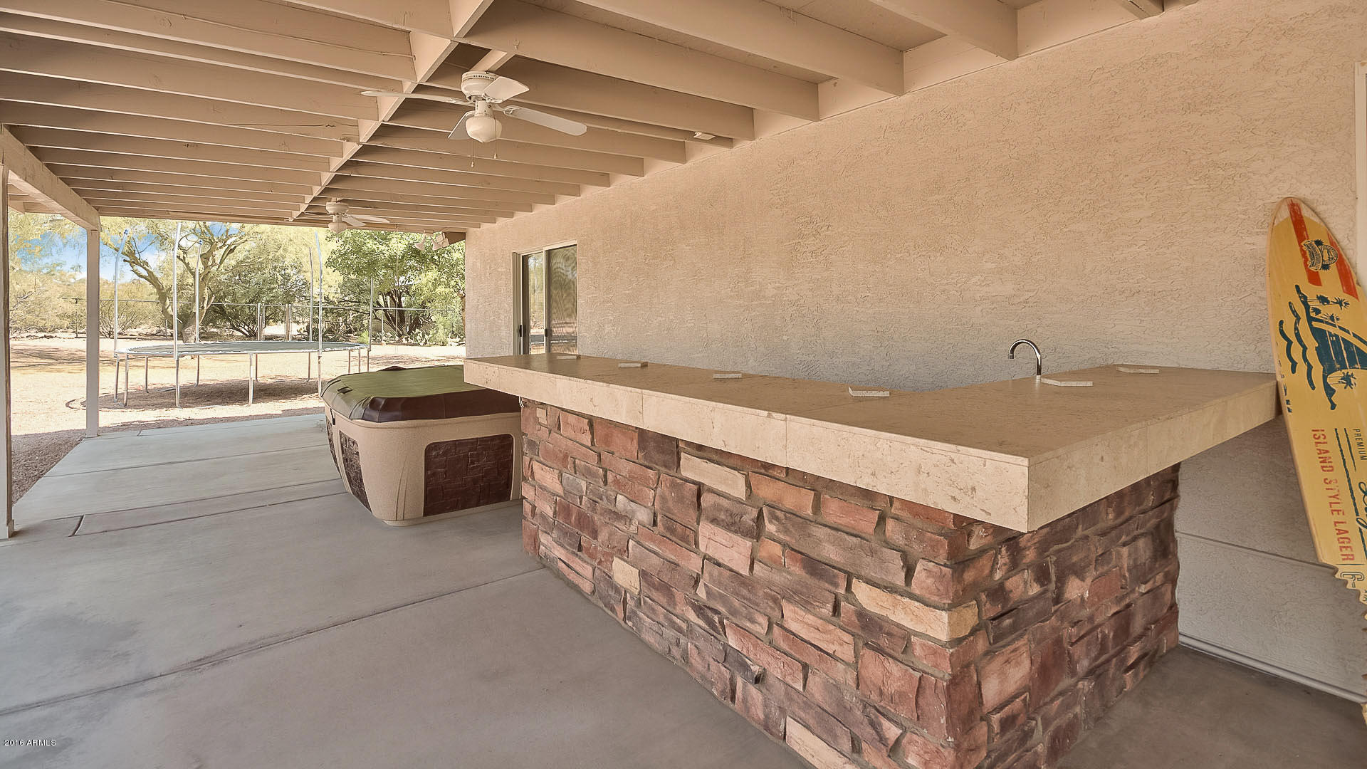 2001 South Mountain View Road Apache Junction, AZ 85119 - Photo 6 of 46 a kitchen with sink cabinets and outdoor living space
