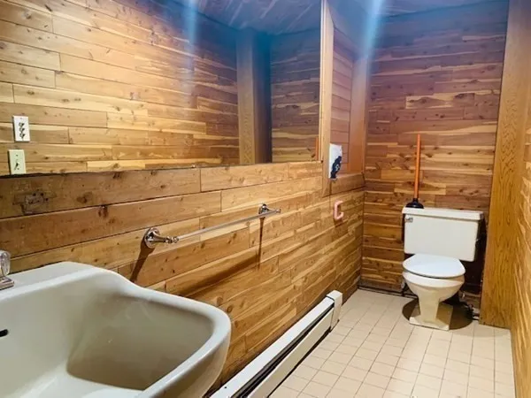 a bathroom with a toilet and a sink