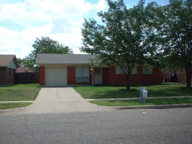5105 Susan Drive Amarillo, TX 79110 - Photo 1 of 8 a front view of a house with a yard and trees