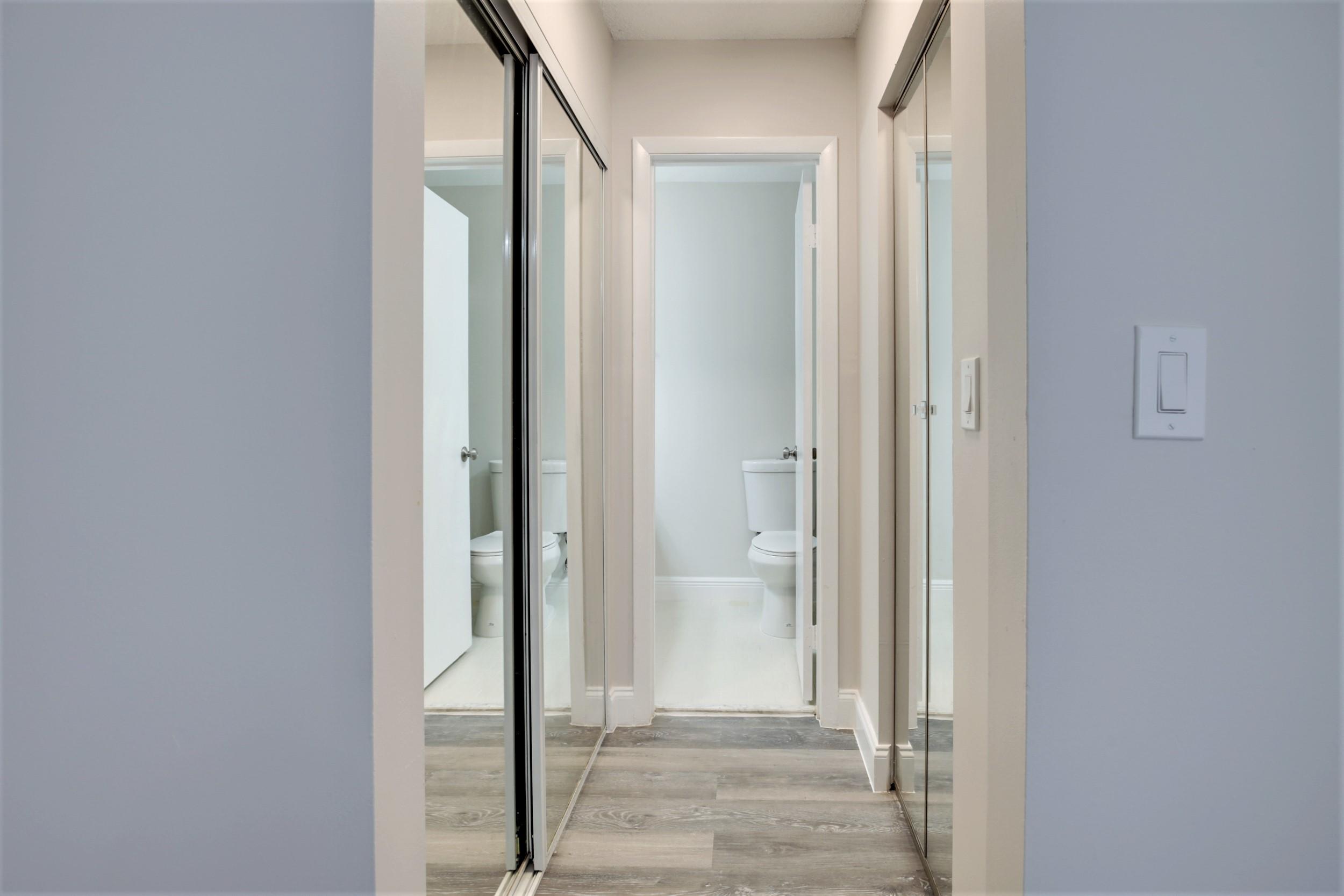 484 Springdale Circle, Unit 48D Palm Springs, FL 33461 - Photo 19 of 59 a view of a bathroom with a glass door