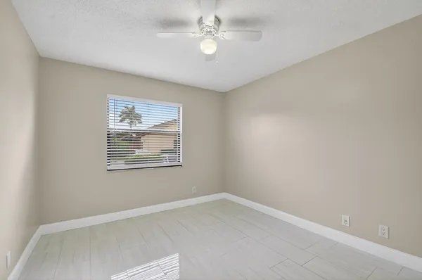 a view of a back yard from a balcony