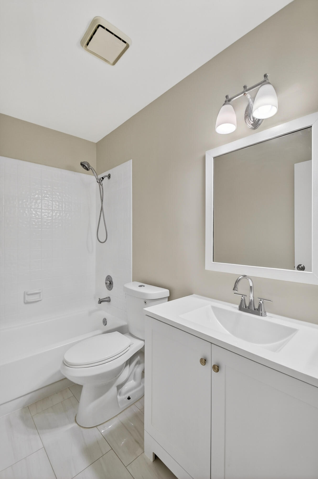 484 Springdale Circle, Unit 48D Palm Springs, FL 33461 - Photo 34 of 59 a bathroom with a sink toilet tub and shower