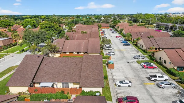 an aerial view of residential houses with outdoor space