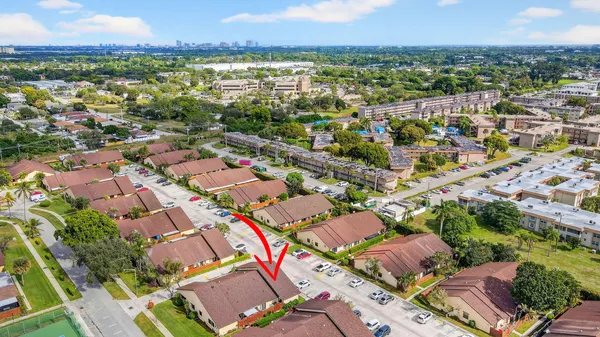 a aerial view of a house with a yard