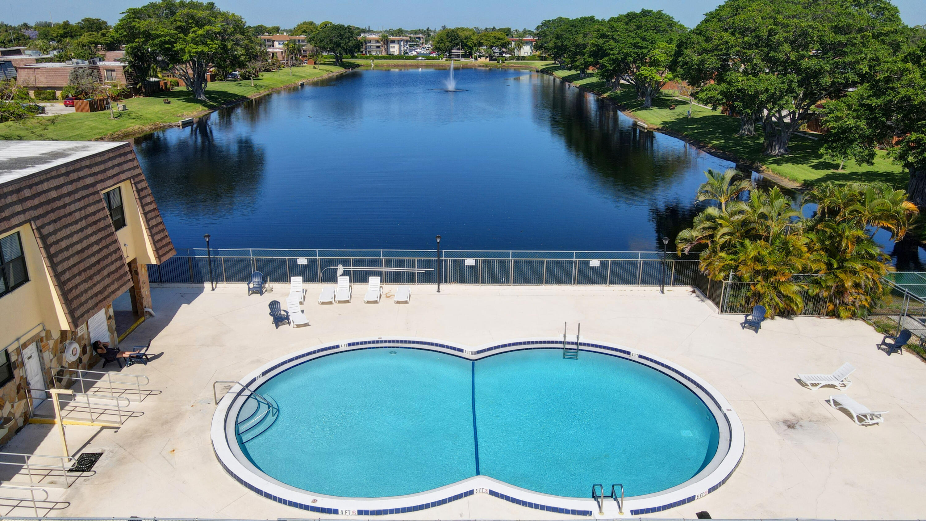 484 Springdale Circle, Unit 48D Palm Springs, FL 33461 - Photo 58 of 59 a view of outdoor space and lake view