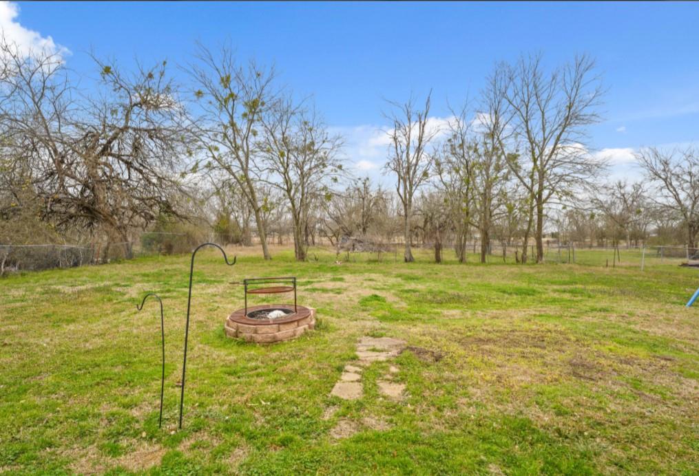 209 Mill Street Lone Oak, TX 75453 - Photo 21 of 29 View of yard with fence and a fire pit