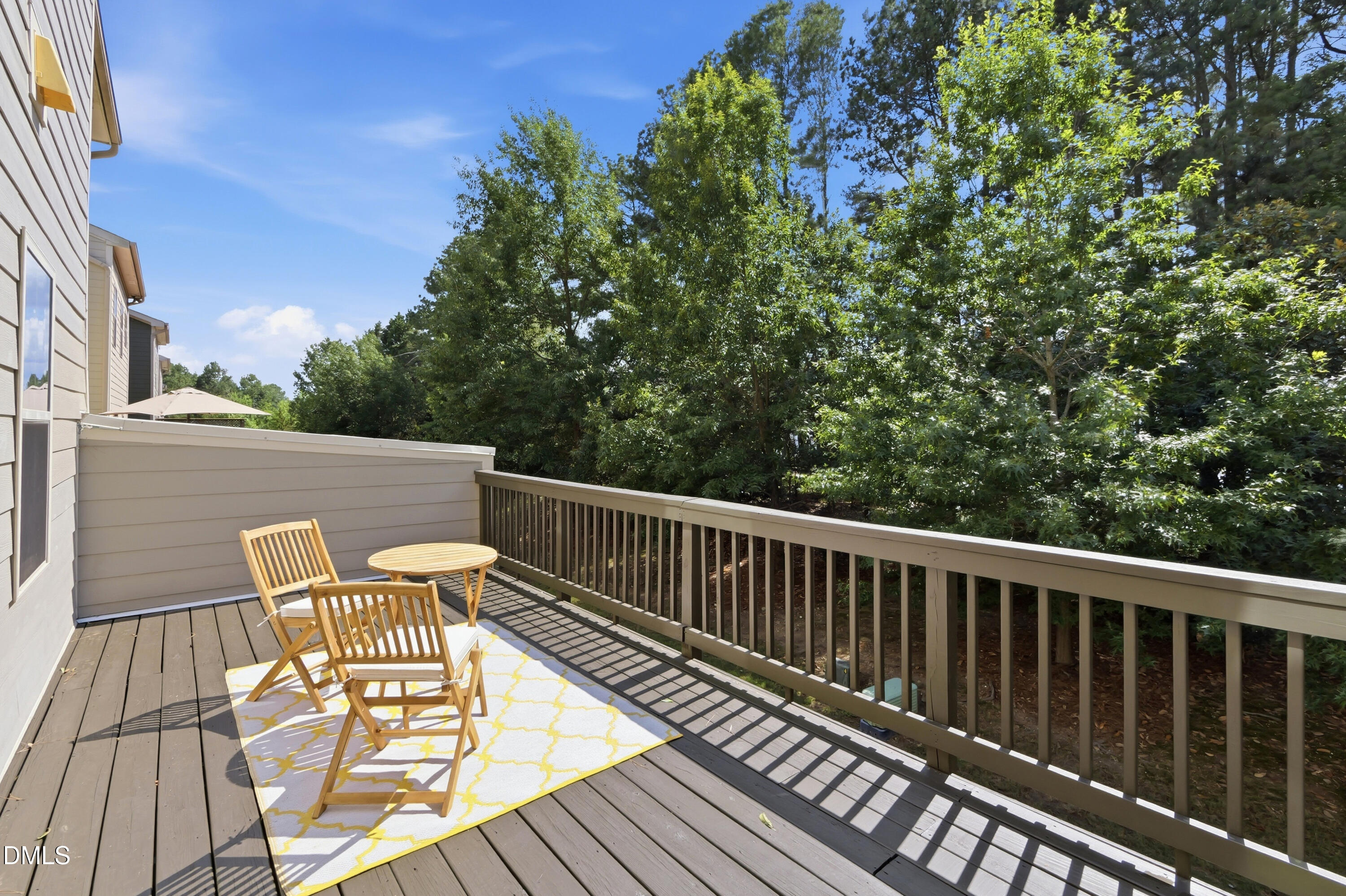 1004 Waymaker Court Apex, NC 27502 - Photo 11 of 30 a balcony with wooden floor and outdoor seating