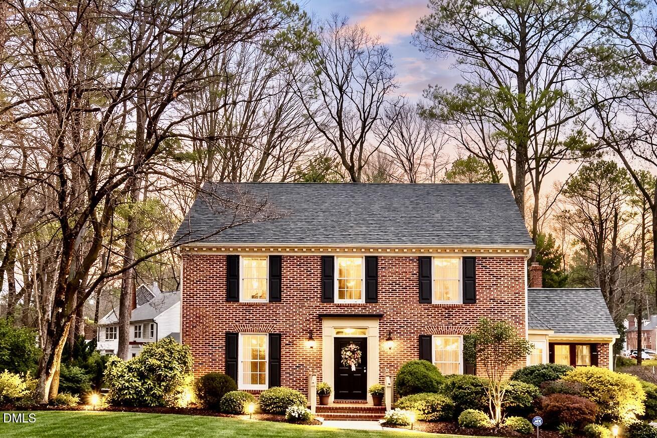 8304 North Crestwyck Court Raleigh, NC 27615 - Photo 1 of 40 a front view of residential houses with yard and trees