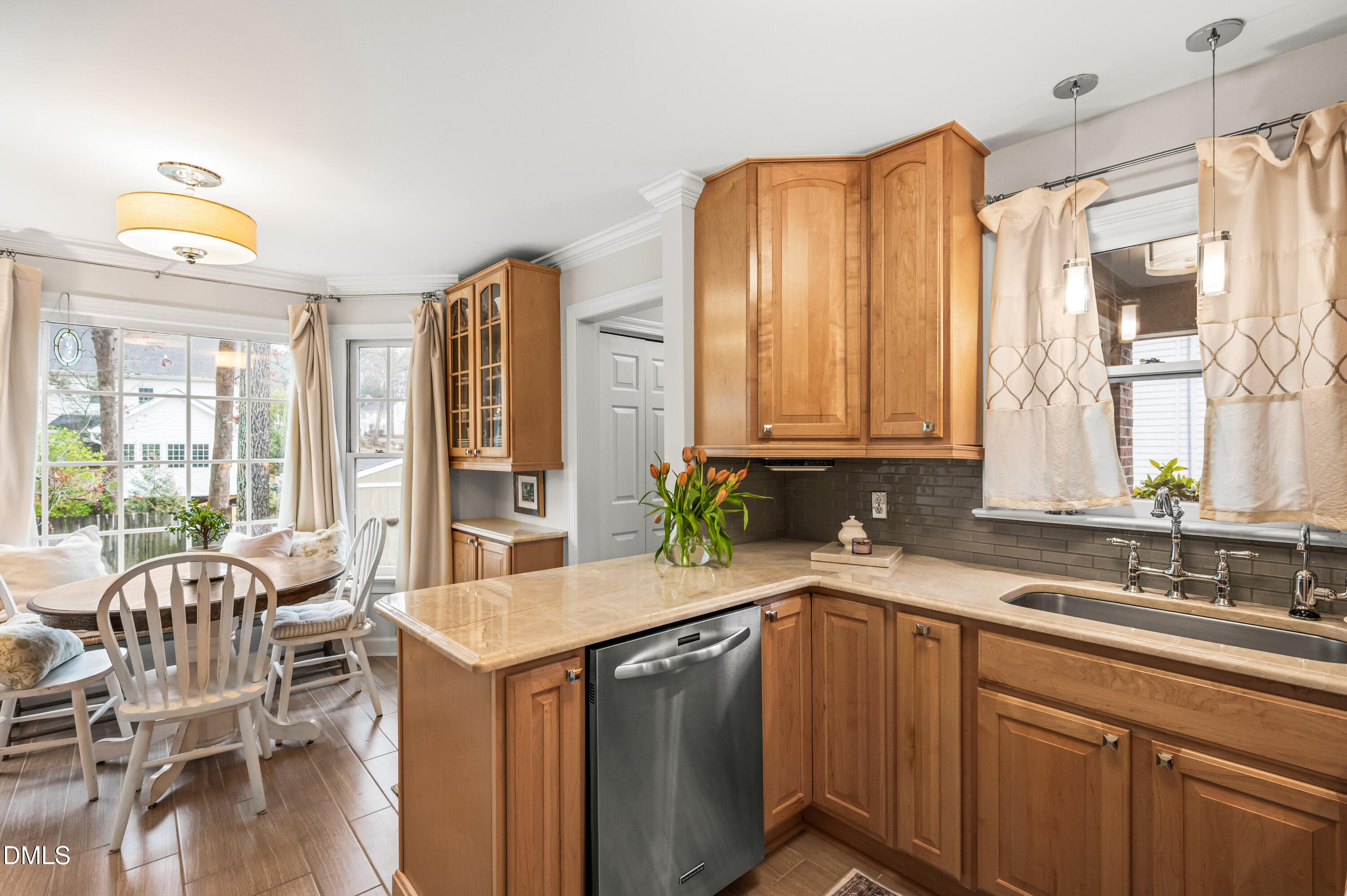 8304 North Crestwyck Court Raleigh, NC 27615 - Photo 11 of 40 a kitchen with a sink cabinets and window