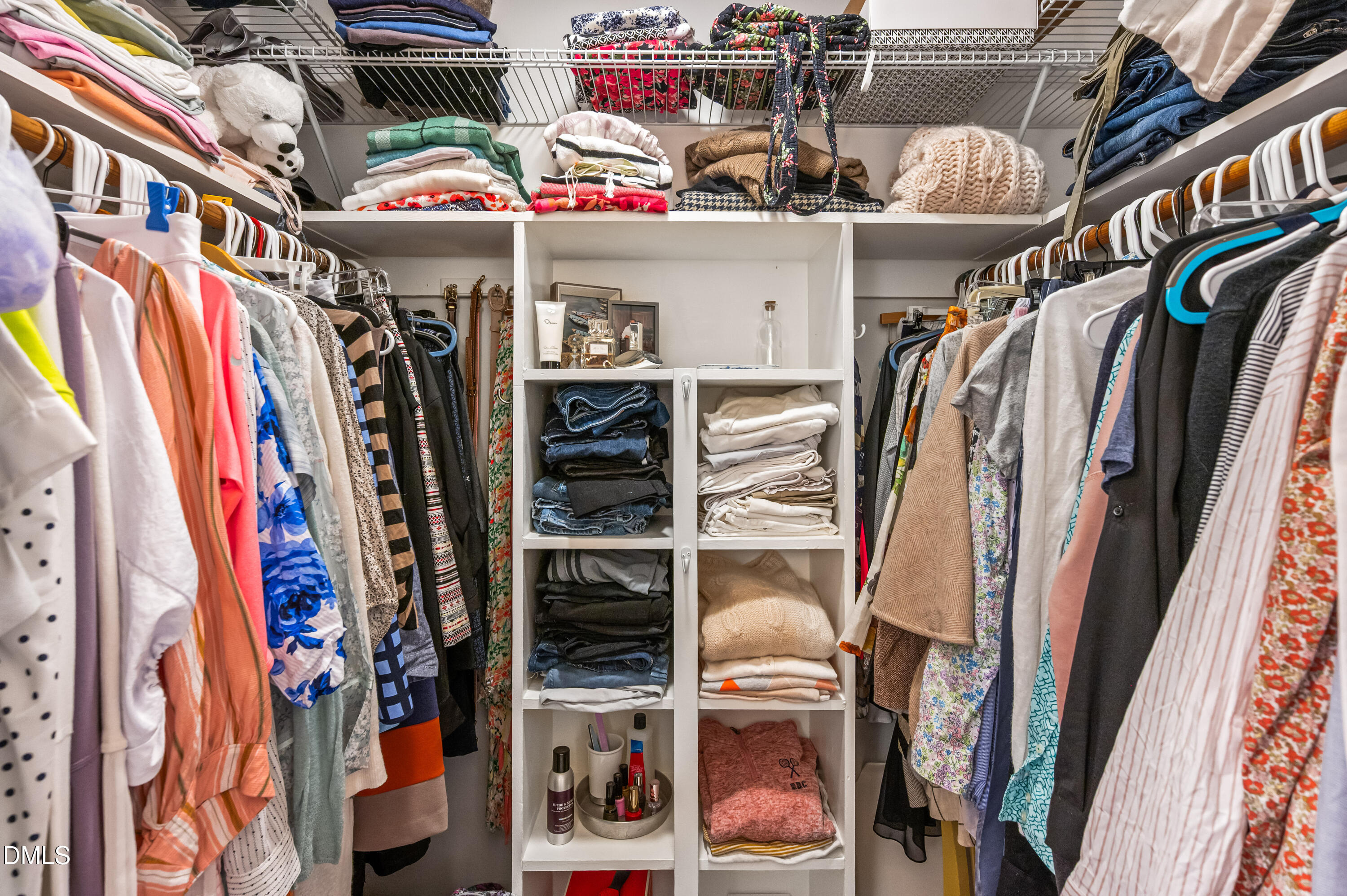 8304 North Crestwyck Court Raleigh, NC 27615 - Photo 23 of 40 a view of walk in closet with clothes and shoes