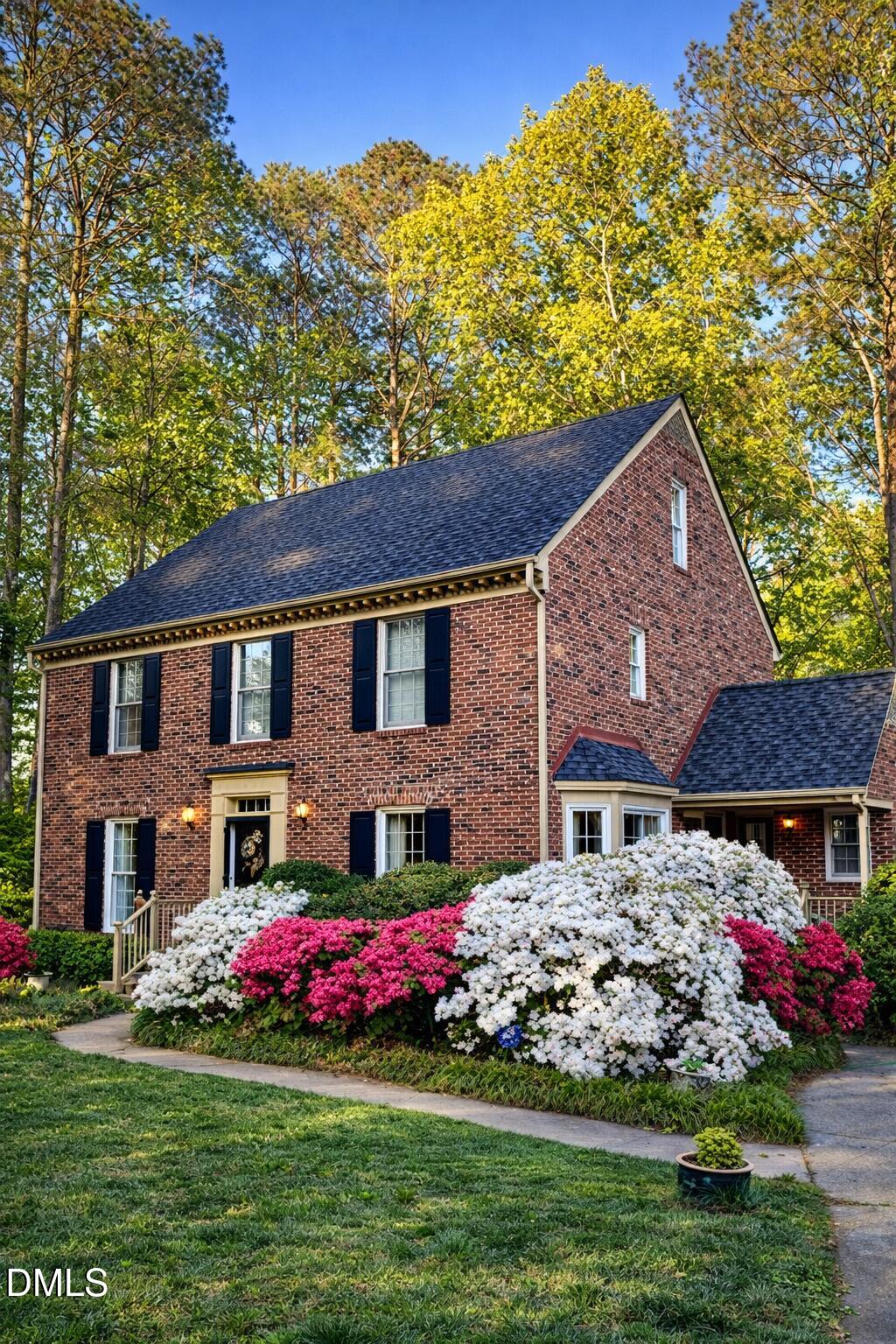 8304 North Crestwyck Court Raleigh, NC 27615 - Photo 2 of 40 a front view of a house with a yard and fountain