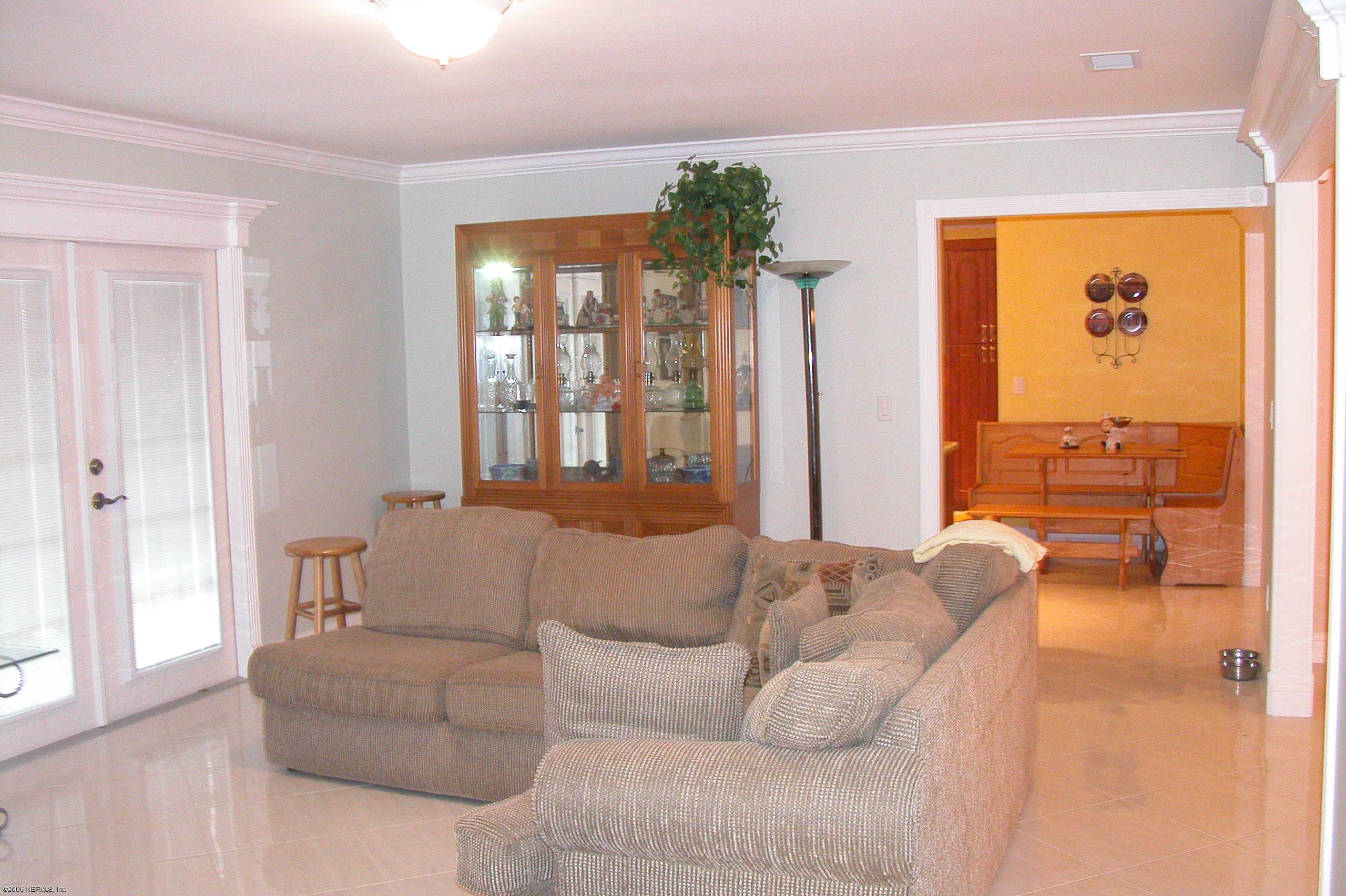 5102 Spring Haven Road Orange Park, FL 32065 - Photo 8 of 12 Family Room into Kitchen