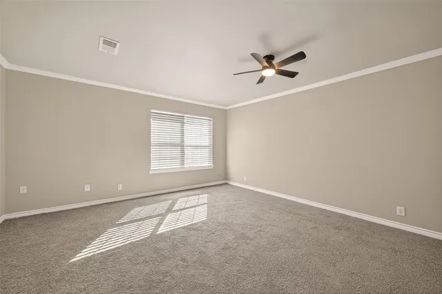 a view of a big room with closet and windows