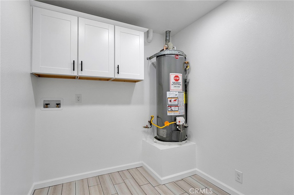 11076 Wagon Train Road Pinon Hills, CA 92371 - Photo 13 of 24 a view of storage and utility room with washer and dryer