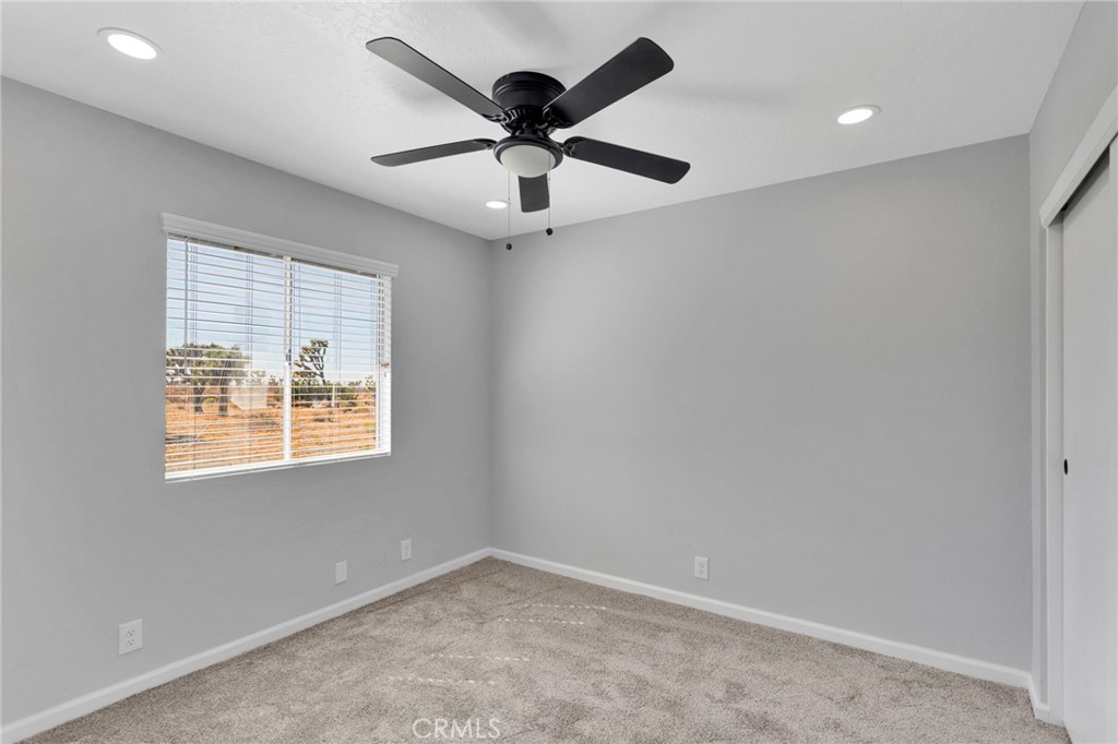 11076 Wagon Train Road Pinon Hills, CA 92371 - Photo 18 of 24 a view of an empty room with a window