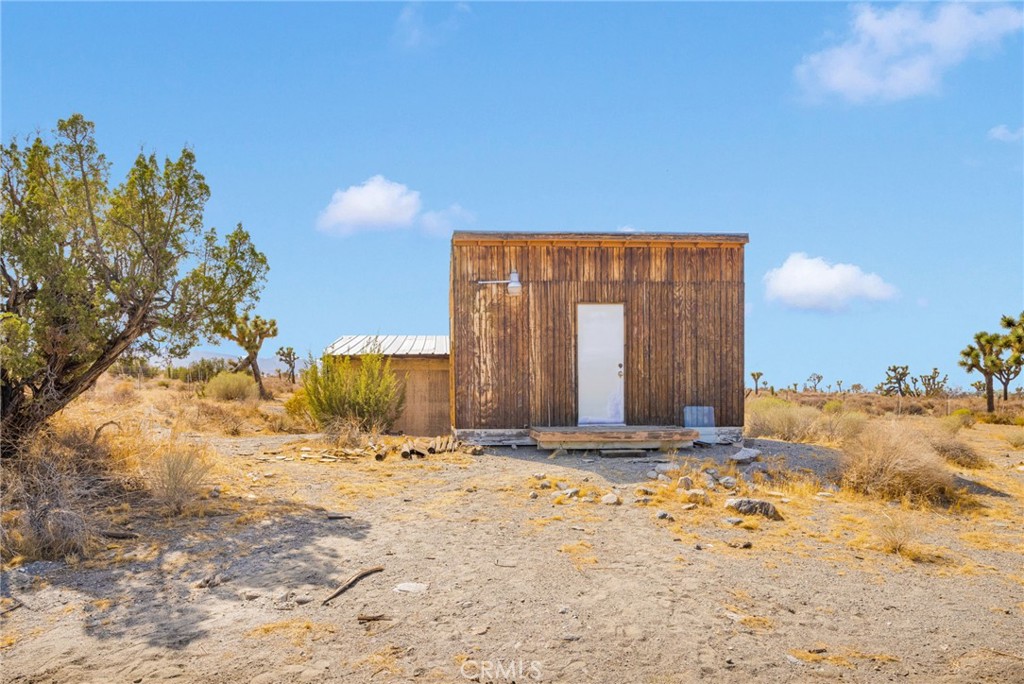 11076 Wagon Train Road Pinon Hills, CA 92371 - Photo 23 of 24 a view of a house with a snow in the yard