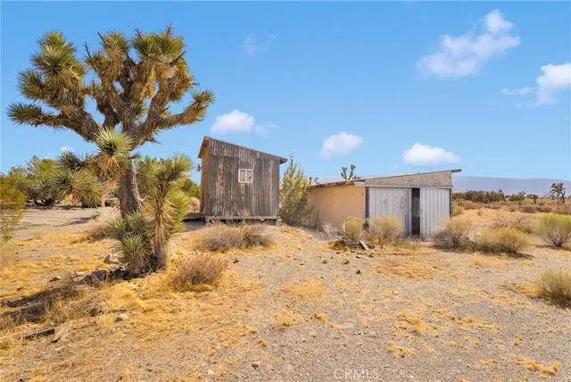 a view of a house with a snow in the yard