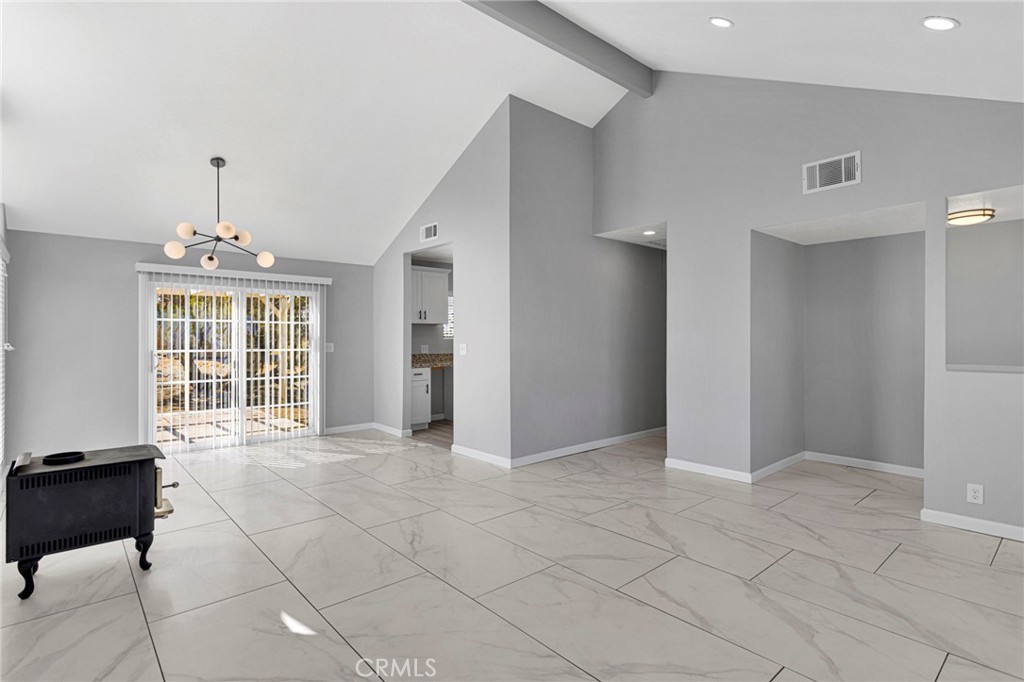 11076 Wagon Train Road Pinon Hills, CA 92371 - Photo 7 of 24 a view of an empty room with a window