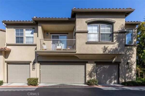 a front view of a house with a garage