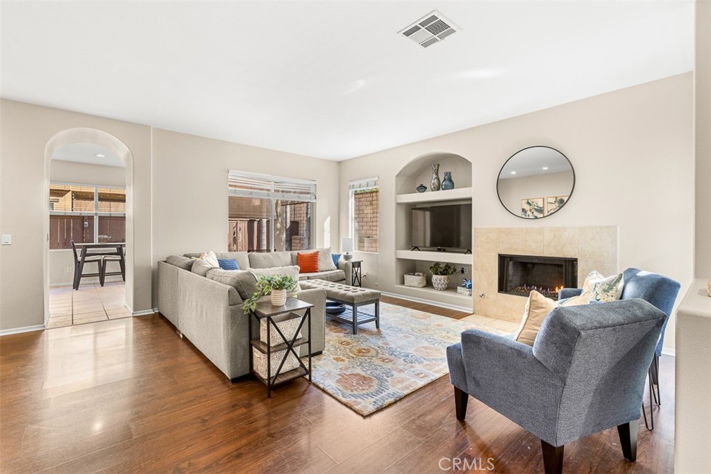 638 Sumner Way Oceanside, CA 92058 - Photo 5 of 17 a living room with furniture a fireplace and a flat screen tv