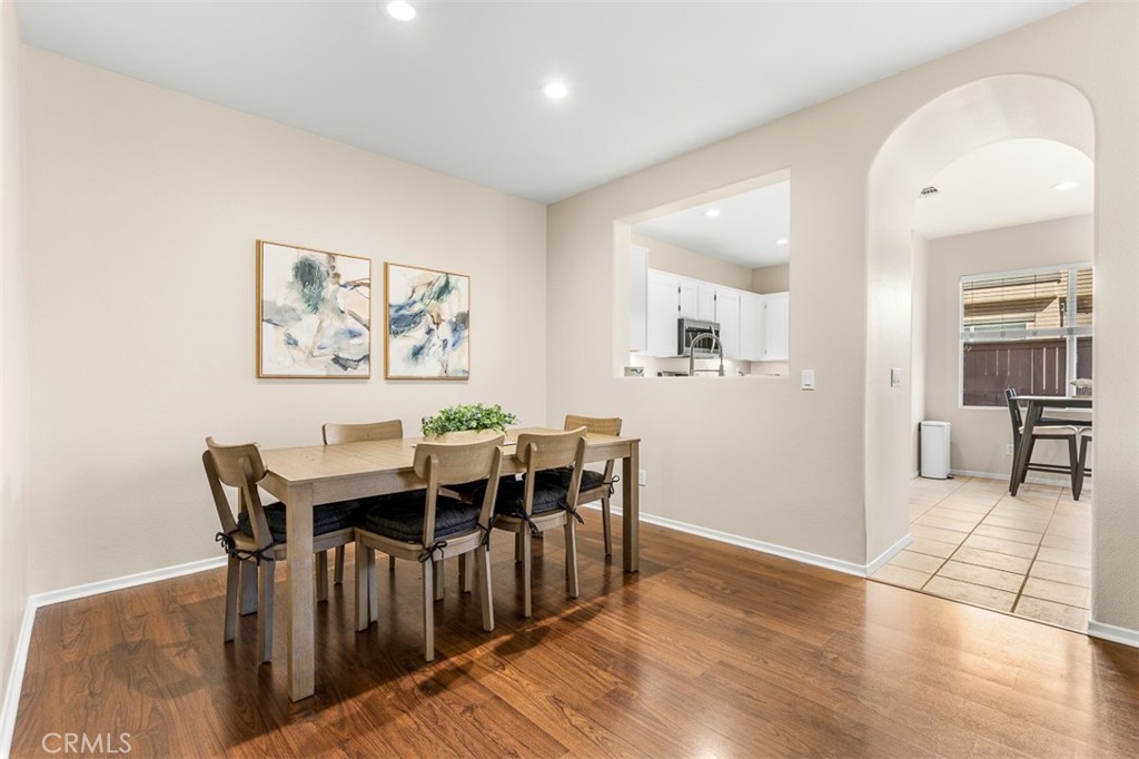 638 Sumner Way Oceanside, CA 92058 - Photo 7 of 17 a view of a dining room with furniture and wooden floor