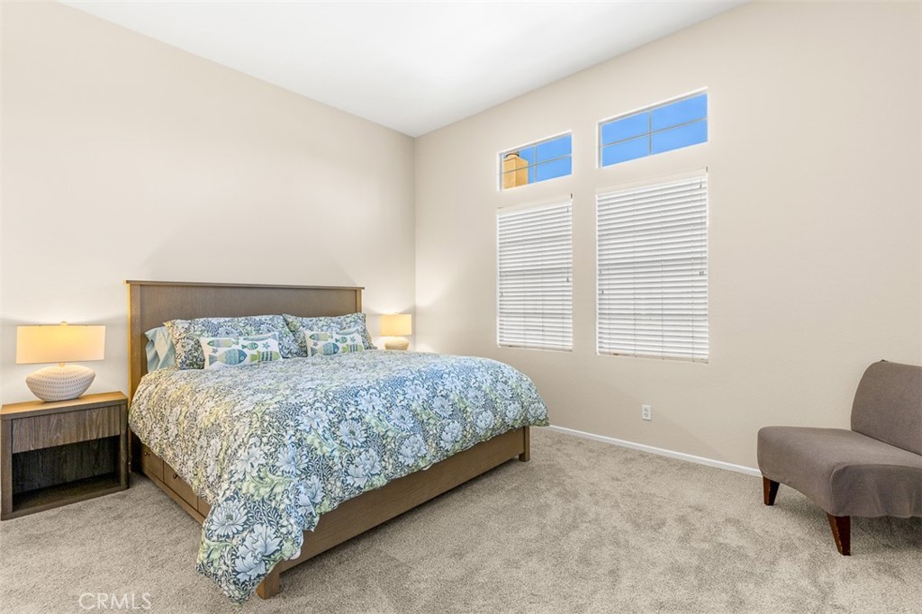 638 Sumner Way Oceanside, CA 92058 - Photo 8 of 17 a bedroom with a bed and a couch