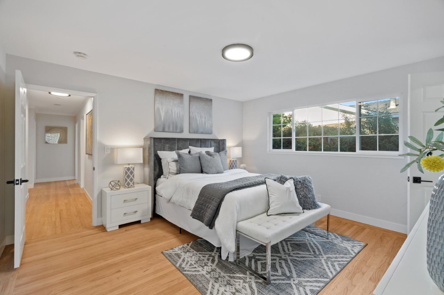 1720 Havenhurst Drive Los Altos, CA 94024 - Photo 14 of 49 a bedroom with a bed and wooden floor