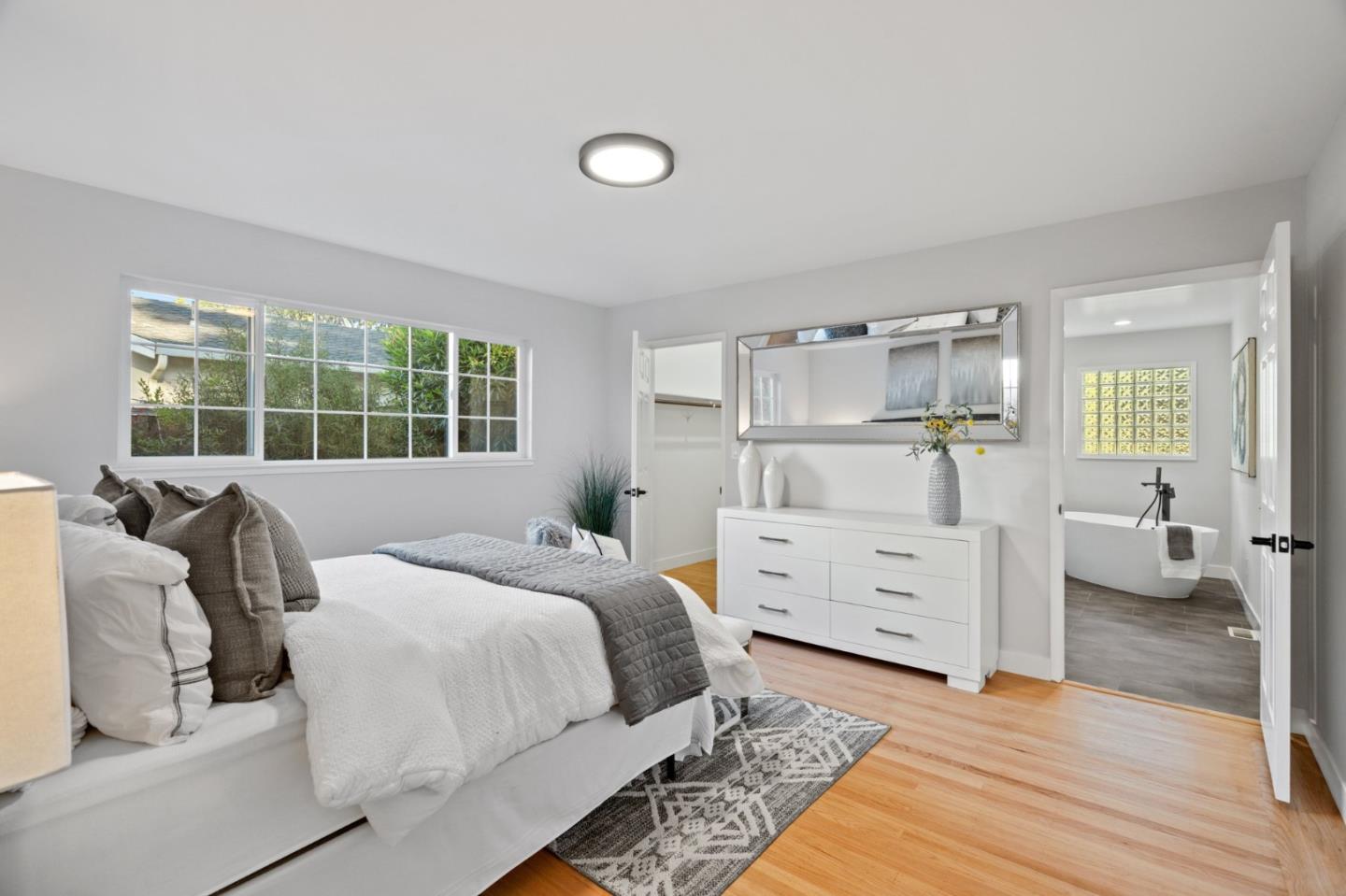 1720 Havenhurst Drive Los Altos, CA 94024 - Photo 15 of 49 a bedroom with a bed and wooden floor