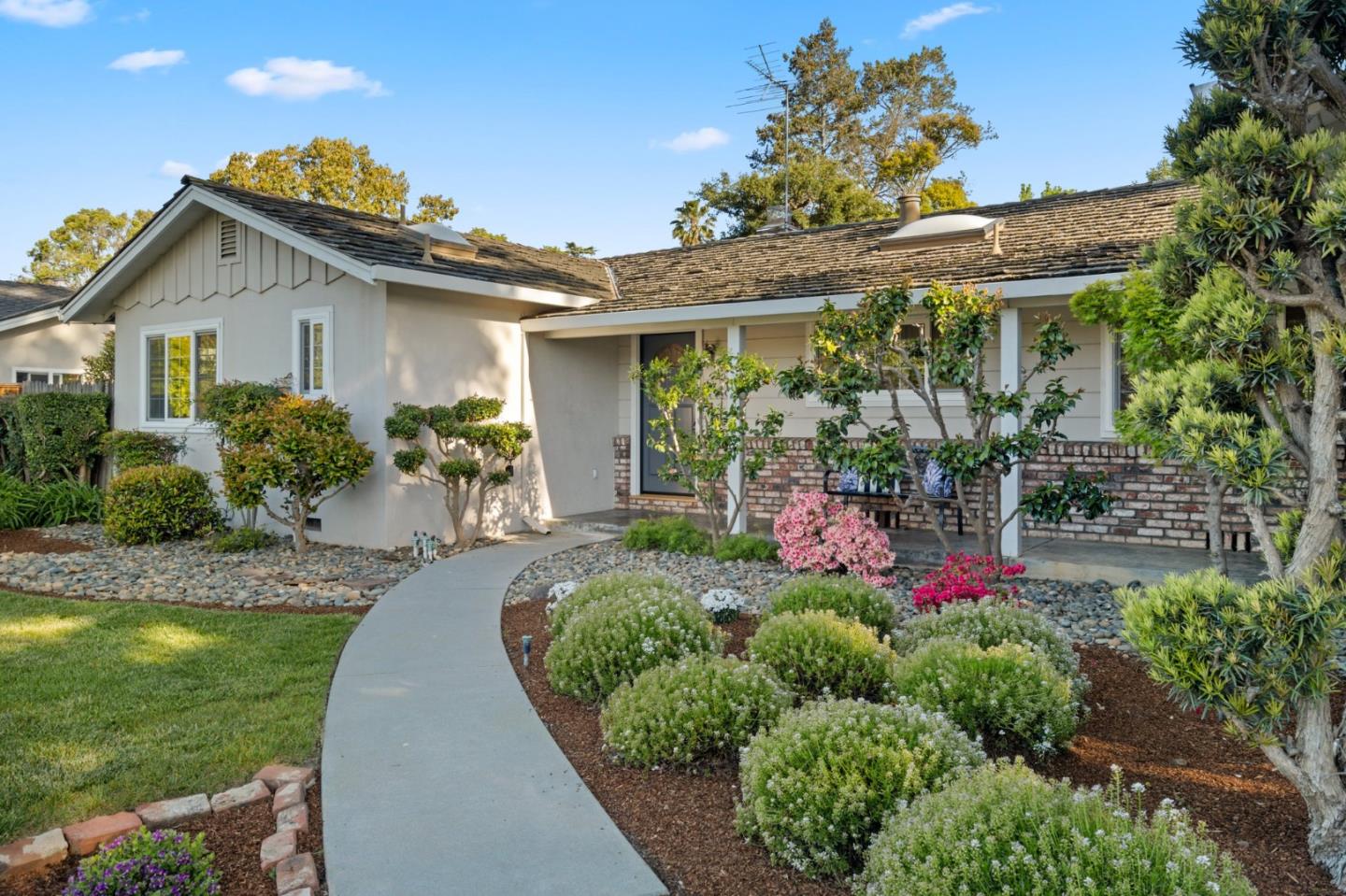 1720 Havenhurst Drive Los Altos, CA 94024 - Photo 27 of 49 a front view of a house with a yard and potted plants