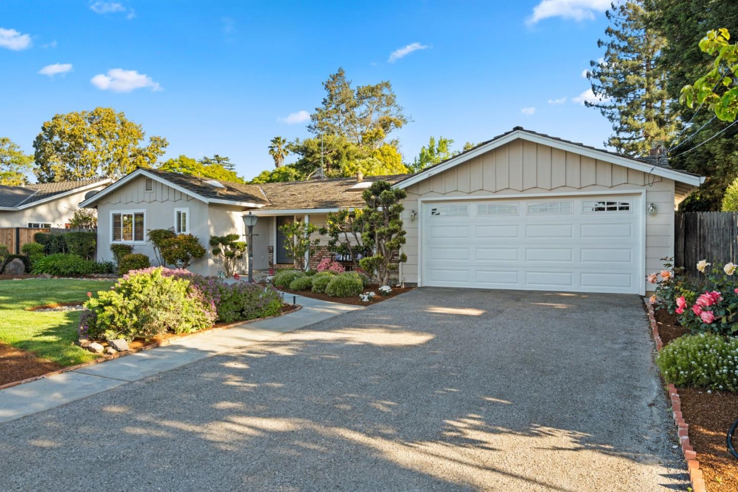 1720 Havenhurst Drive Los Altos, CA 94024 - Photo 32 of 49 a front view of a house with a yard and garage