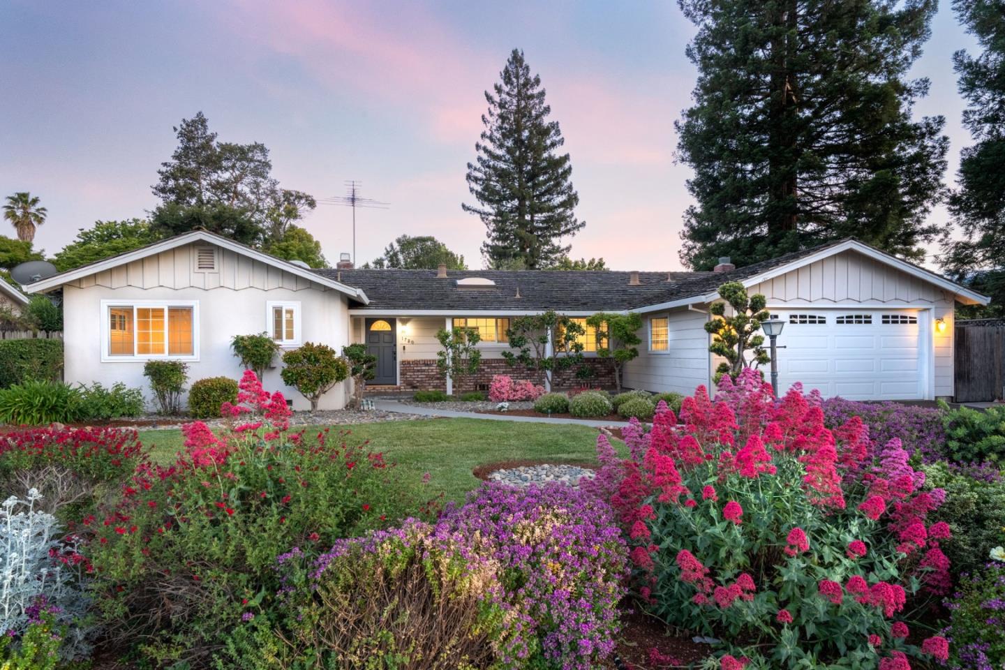 1720 Havenhurst Drive Los Altos, CA 94024 - Photo 38 of 49 a front view of a house with a big yard and potted plants