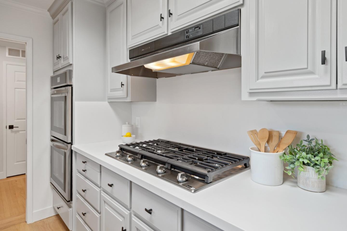 1720 Havenhurst Drive Los Altos, CA 94024 - Photo 7 of 49 a kitchen with a stove and a microwave