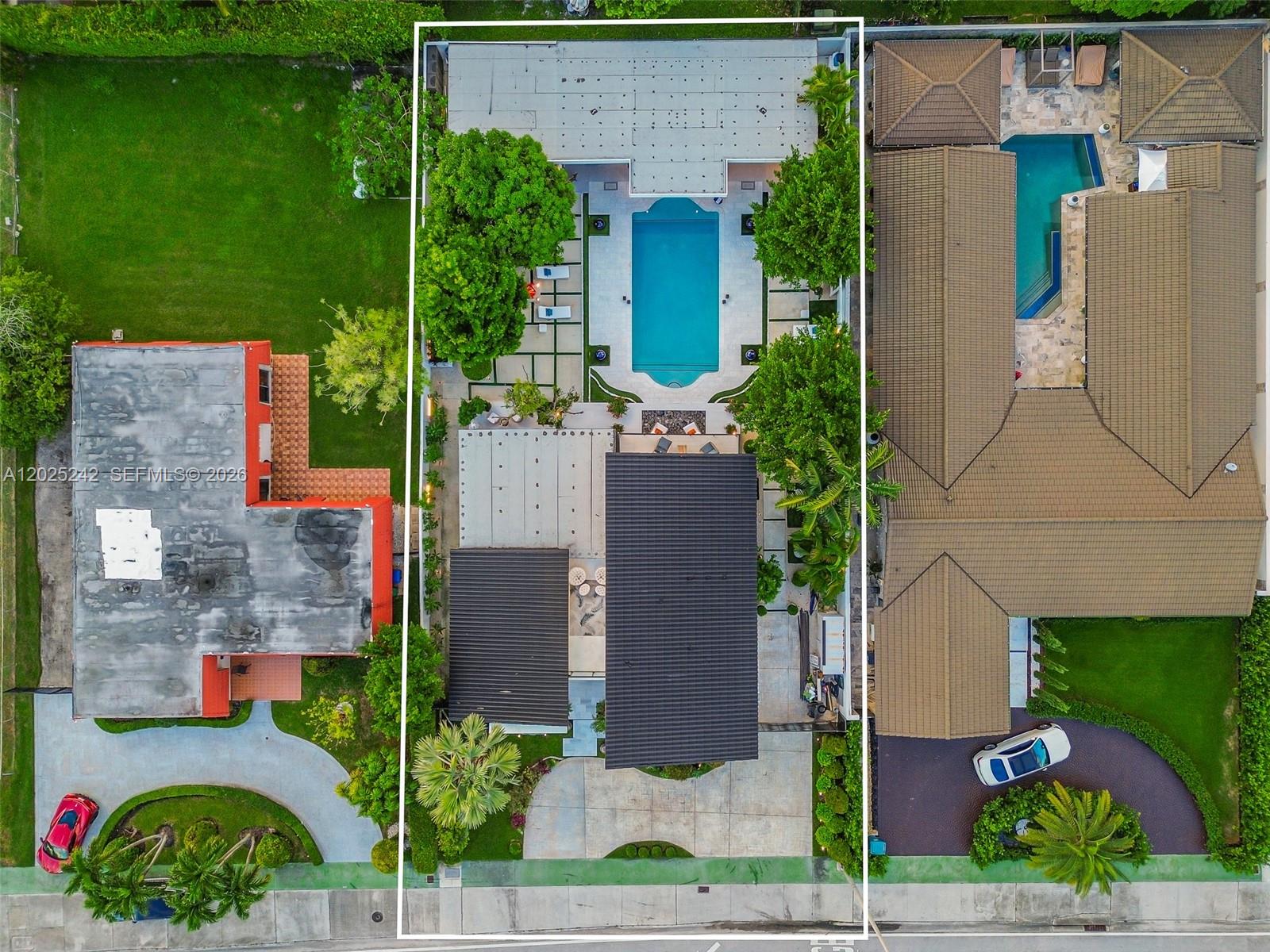 8761 Southwest 56th Street Miami, FL 33165 - Photo 10 of 90 an aerial view of a house with a yard and potted plants